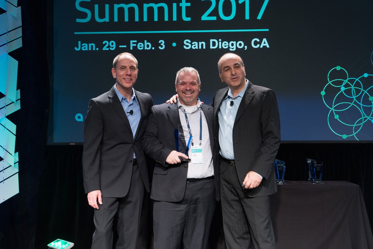 Gregg getting award with Jon and Ali.jpg